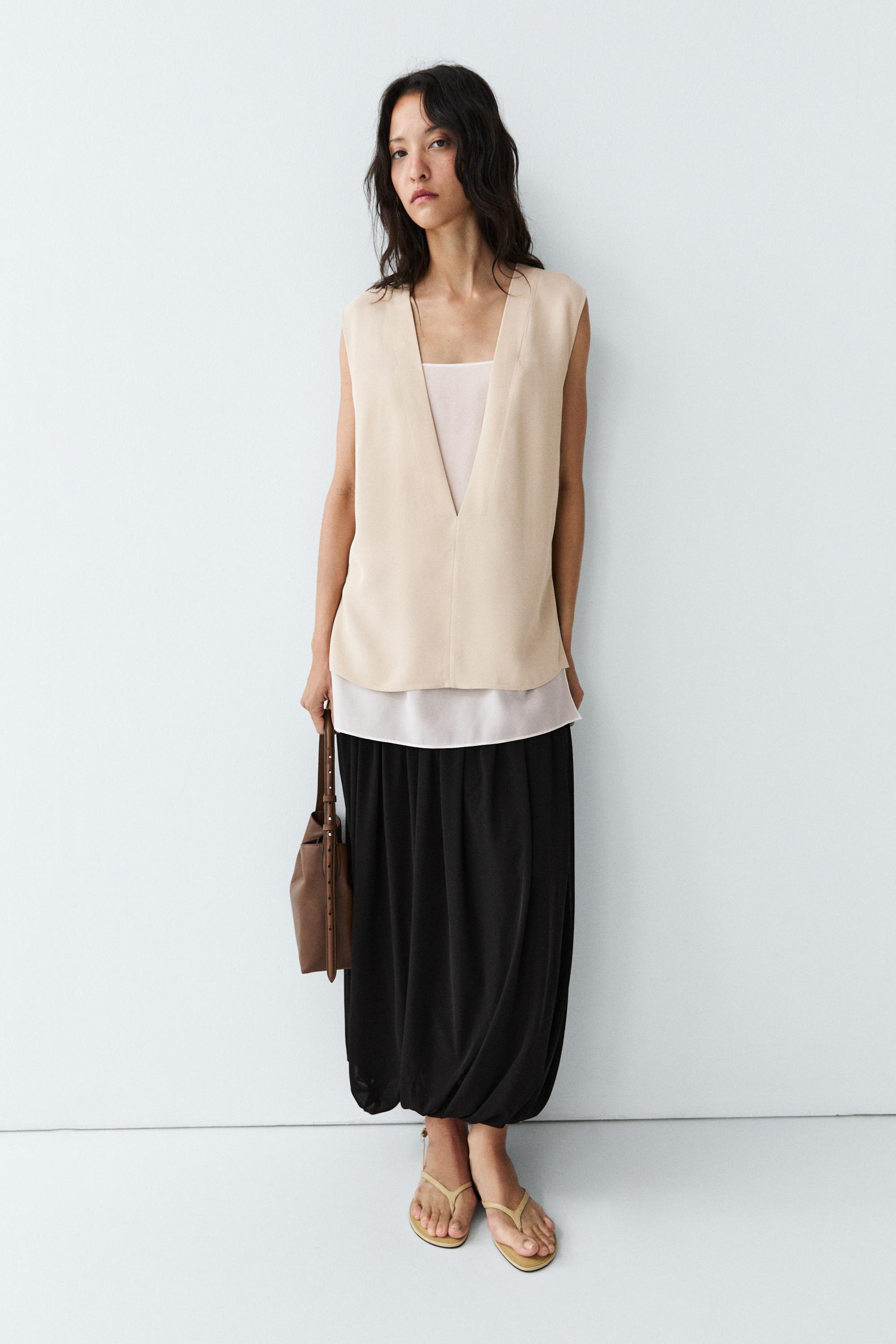 Flowing double-layer top with contrast detail